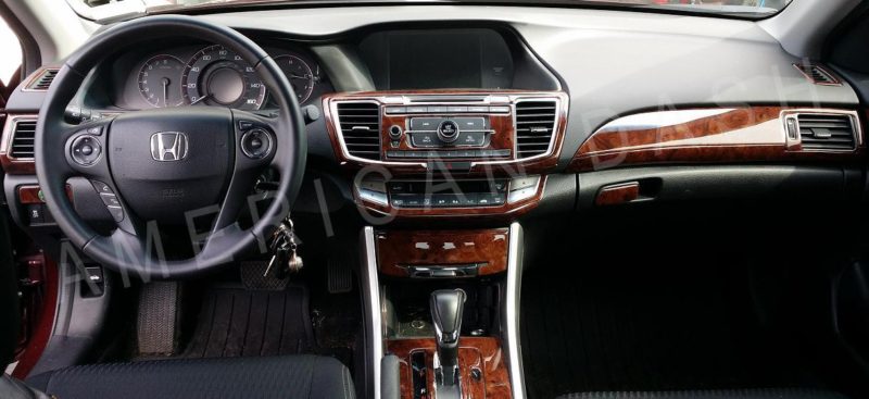 The interior of a car with a wood trim and an accessories for car.