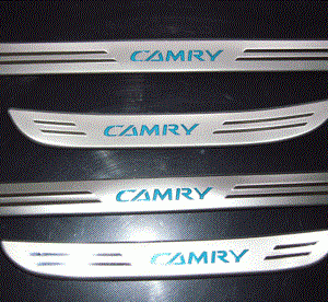 A set of stainless steel door handles with the word Compatible with Toyota Camry 2007 - 2008 Door Sills on them, perfect for car accessories.