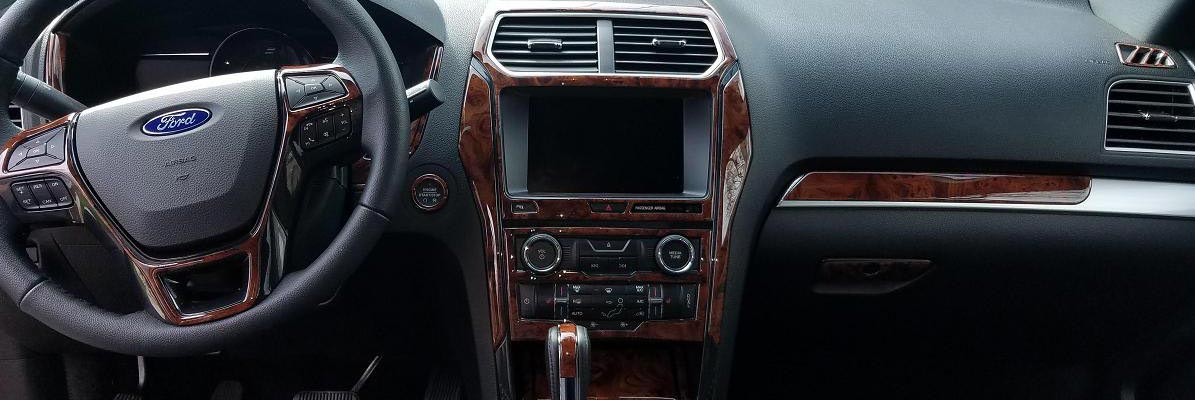 The car's interior features a wood trim along with an interior dash trim kit.