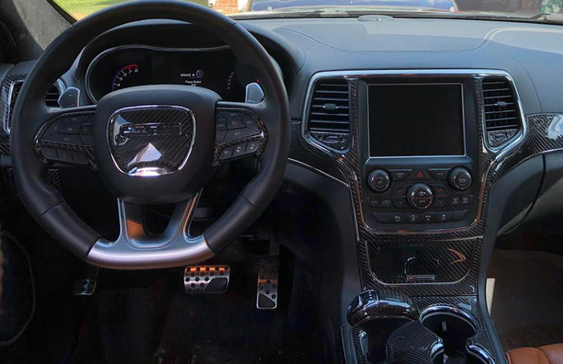The car's interior can be enhanced with a Fits Jeep Grand Cherokee 2014 2015 2016 2017 Basic Dash Trim Kit, also known as an Interior Dash Trim Kit or Car Dash Kit.