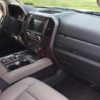 The wood dash kit complements the interior of a Ford F-150 pickup truck.