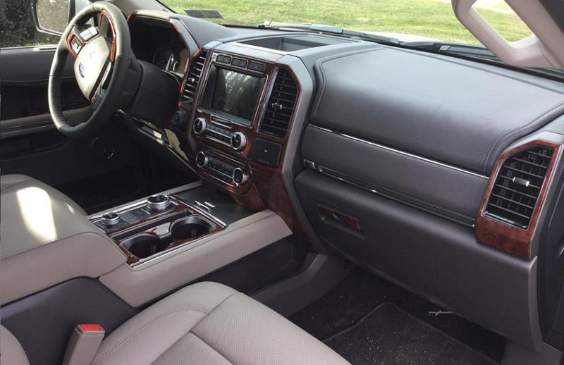 The wood dash kit complements the interior of a Ford F-150 pickup truck.
